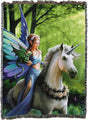 Tapestry blanket of fairy with dragon on wrist riding unicorn through green forest