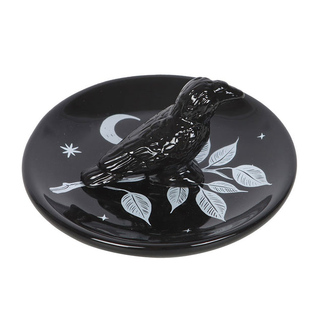 Black ceramic dish with a raven bird design, leaves and moon