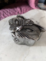 Silver colored cat trinket box with jewel on forehead, shown with lid in place