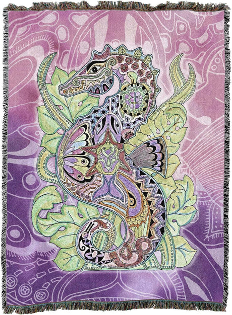 Tapestry blanket featuring a colorful Seahorse design with other animals on a purple background