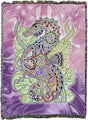 Tapestry blanket featuring a colorful Seahorse design with other animals on a purple background