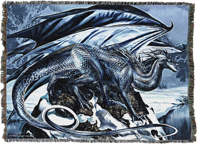 Woven blanket with a dragon design on a blue and gray winter mountain background