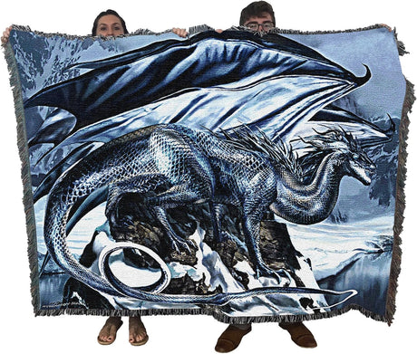 Dragon-themed blanket held by two people with a snowy landscape background