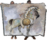 Blanket with a battle unicorn design held by two people against a white background