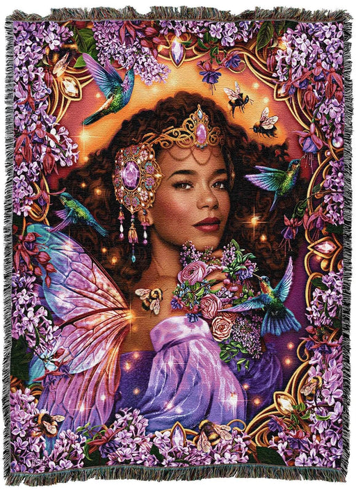 Tapestry Blanket with dark skinned fairy, dark hair, iridescent butterfly wings. Surrounded by lilac flowers, jewels, bees, and hummingbirds