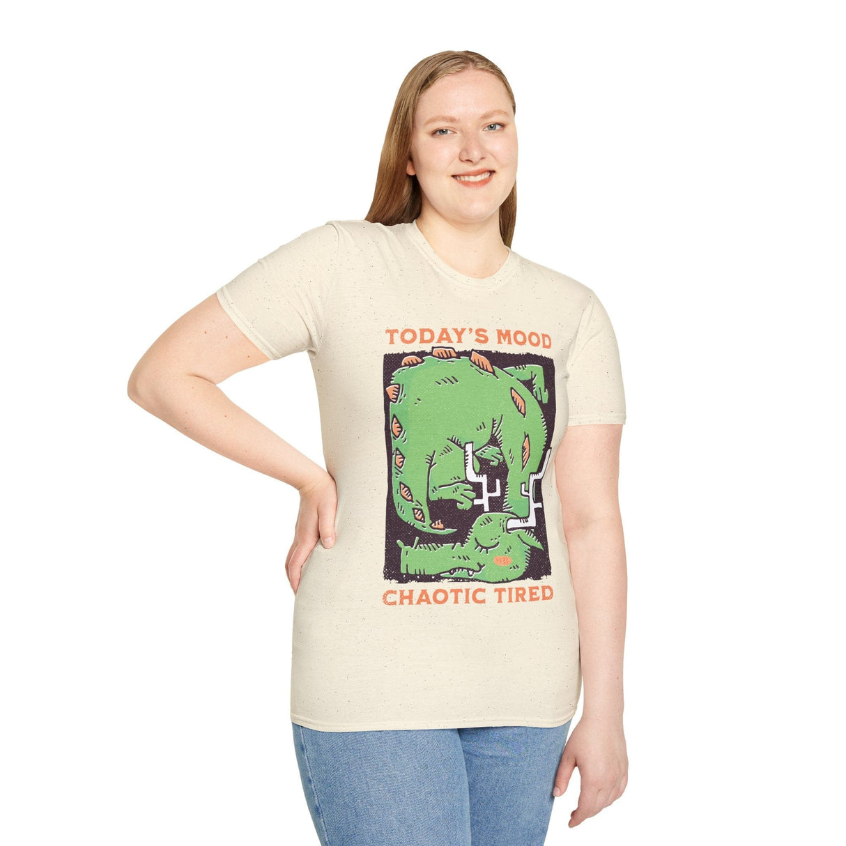Woman wearing off white t-shirt with a graphic of a green dragon and text 'Today's Mood: Chaotic Tired'