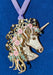 Brass ornament of a white unicorn bust with pink roses and green leaves