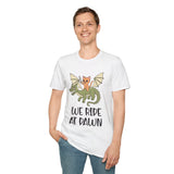 Person wearing white t-shirt with a cat riding a dragon graphic and 'We Ride at Dawn' text