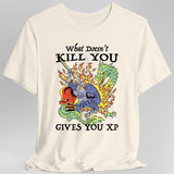 Natural/off white t-shirt with a graphic design of knight fighting a dragon and text reading "What Doesn't Kill You Gives You XP"