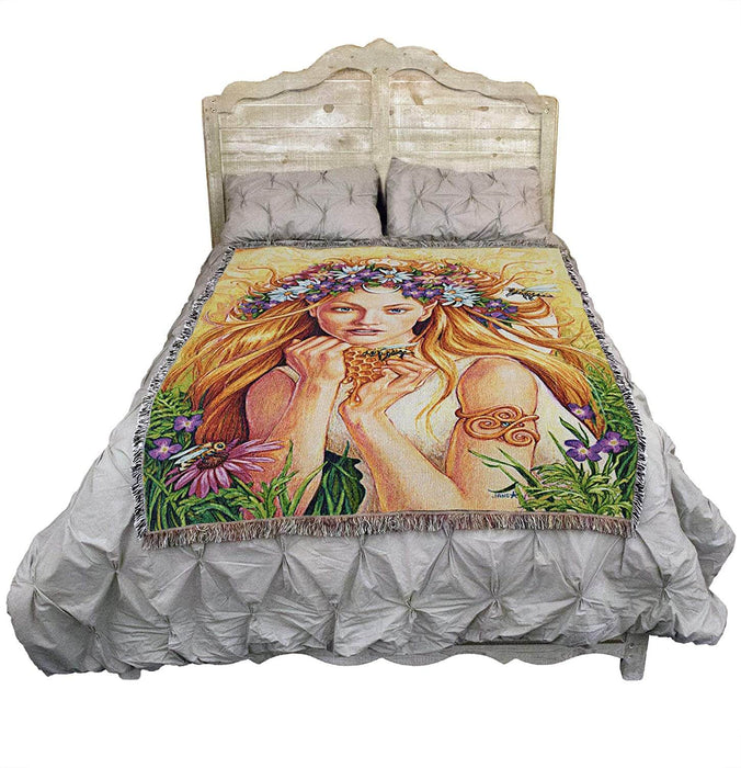 Wild Honey blanket shown draped over a bed