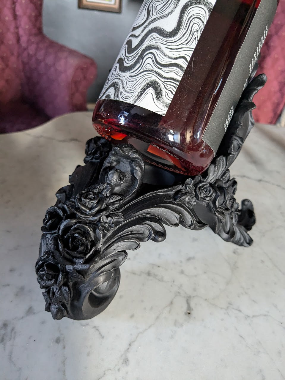 Detail of rose wine bottle holder in black