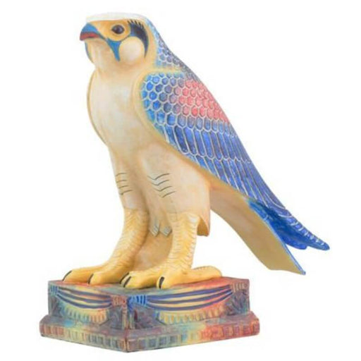 Colorful Egyptian falcon figurine perched on a stand. Done in shades of blue, red, yellow, cream