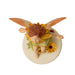 Flower fairy figurine of a pixie in pale green with yellow flower accents and peach-orange wings. Base says "Marigold Fairy"
