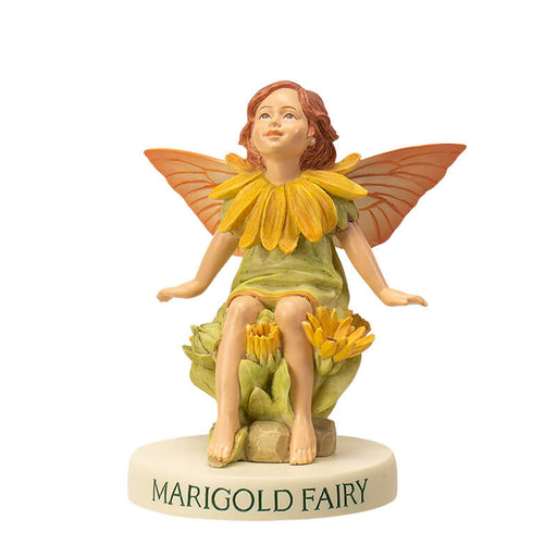 Flower fairy figurine of a pixie in pale green with yellow flower accents and peach-orange wings. Base says "Marigold Fairy"