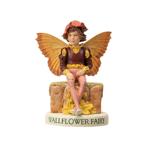 Fairy figurine of a boy with brown and yellow top, tan pants, sitting on a wall with a flower hat. Base says "Wallflower Fairy"