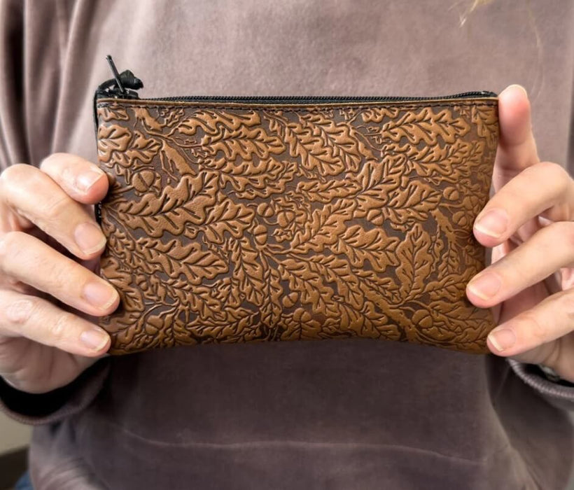 Oak leaves leather pouch held up for size
