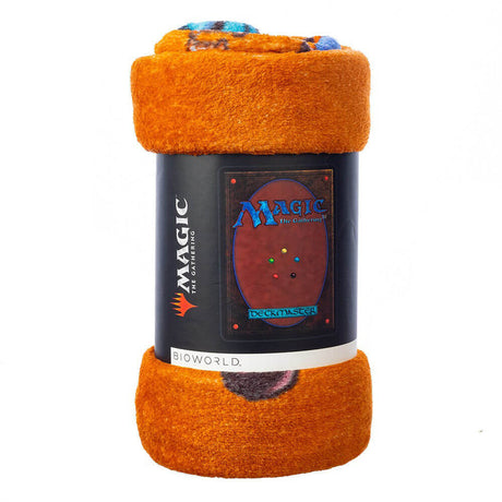 MtG fleece throw shaped like a Magic the Gathering card. It has the logo and "Deckmaster" as well as the elemental circles to look like the cardback.  It is rolled up and packaged in a bundle with a paper band around it.