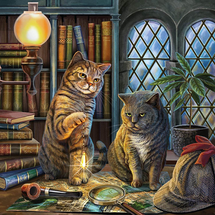 A gray tabby and a black and white cat sit on a desk admidst books a magnifying glass, pipe, and hat. They are reminiscent of Sherlock Holmes and Watson.