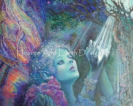 The artwork of Josephine Wall shows a fairy catching a moonbeam in her hands. The pixie lady has rainbow butterfly wings that swirl with color, and pointy ears. The light of the moon steams down through the trees to fill her palms.