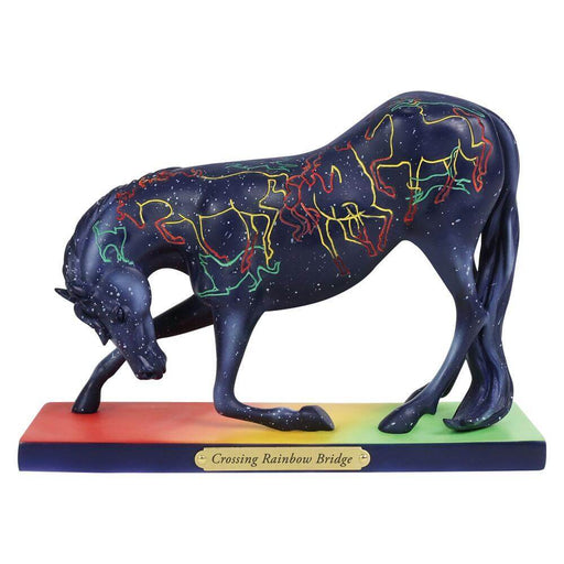Trail of Painted Ponies horse, blue base with white star speckles. Rainbow designs mimicking horses, dogs, and cats with a nameplate of "Crossing Rainbow Bridge" on the rainbow colored base