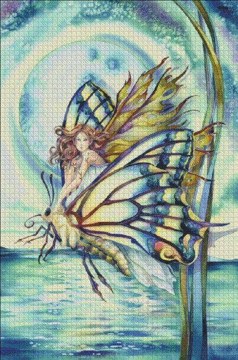 The image revealed as you cross stitch is a fairy riding upon a butterfly. The pixie peers out from between the colorful wings, and a moon rises above the pond in the background. by Jody Bergsma, cross stitch mockup