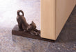 Stretching cat door stopper shown in use