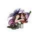 Fairy in pink dress and hat with brown hair and purple white wings leans on a red mushroom. A garden snail sits next to her