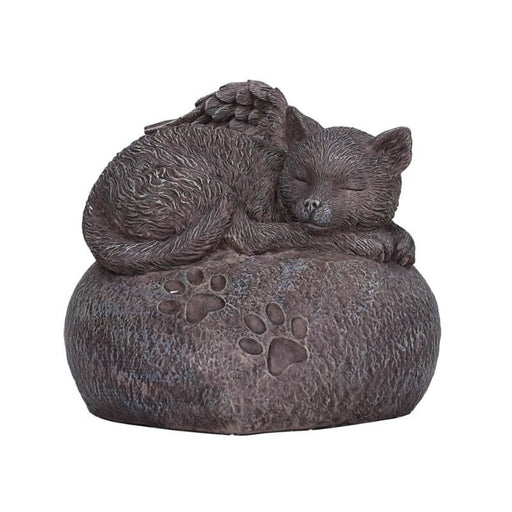A sleeping angel kitty with feathered wings curls up on a heart-shaped rock upon which are two pawprints.
