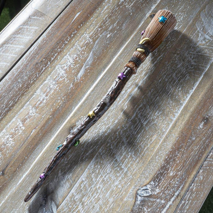 Witch's Broom magic wand with colorful stars and a gold moon