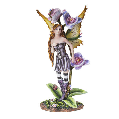 Fairy figurine. The fairy has long brown hair and wears a dark purple-gray dress with corset top and skirt, as well as striped black and white stockings and grape colored boots. She has yellow-tan wings.She stands on the leaves of a orchid plant with purple flowers. There is a ladybug on one leaf