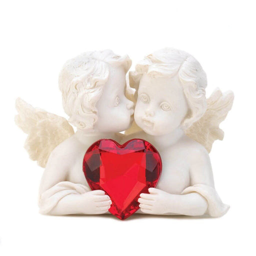 White faux stone cherub giving another one a shy kiss, both hold a red crystal heart