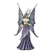 Large fairy figurine in shades of blue, purple, green and teal. Fairy has spotted wings, long hair and antlers.