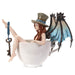 Fairy with steampunk wings in blue and a tophat, and a key looped around her leg. She sits in a teacup, taking a bath