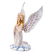 Praying angel figurine, shown from the side. The flowers in her hair are pink