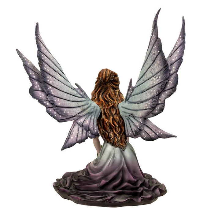Fairy figurine shown from the back with her long hair