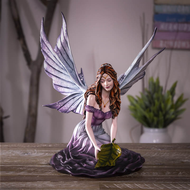 Leaf fairy figurine shown on a table in a home setting