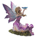 Fairy figurine; she has brown hair and a purple dress surrounded by matching flowers. She looks up at the blue butterfly perched on her outstretched hand. Shown from the side