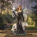 Brunette fairy archer in black dress with bow and white wolf companion. Shown in a forest setting