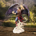 Air wizard with purple-blue feathered wings, standing on a cloud with a transparent white eastern dragon. The sorcerer has a ball of air energy in one hand and an outfit of red and blue. Shown against a forest backdrop