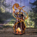 Fire wizard statue based on Anne Stokes artwork. Clad in armor and with horns. Bonfire in front of him and translucent fire swirling up around him in curving patterns. Shown in a forest setting.