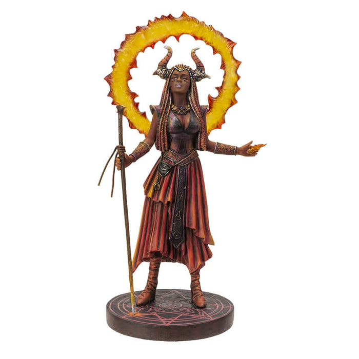 Fire Sorceress figurinec clad in red, orange and black clothes, holding a staff with a ring of fire around her horned head. Stands on black decorated base.