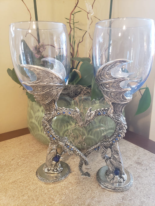 Dragon wine glasses with two dragons nuzzling and forming the shape of a heart.