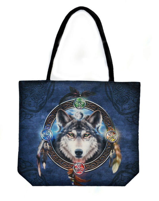 Wolf guide tote bag with wolf and feathers against a blue background