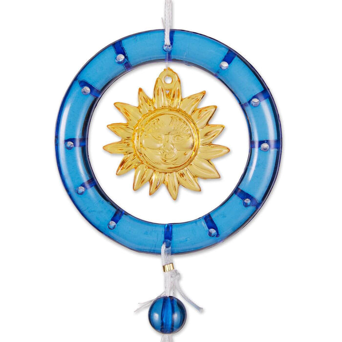 Closeup of the golden yellow suna nd blue ring of the wind chime