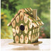 Wooden birdhouse displayed outside