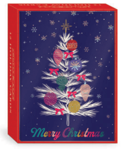 Christmas cards with text of "Merry Christmas" in rainbow font and a white tree decorated with colorful ornaments, with a blue background