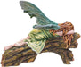 The statue features a lovely pixie sleeping on a forest log. The fae lady has a green dress and leafy emerald dragonfly wings to match. Her red-brown hair is adorned with colorful flower blossoms, and purple mushrooms sprout from the wood she slumbers on. Back view