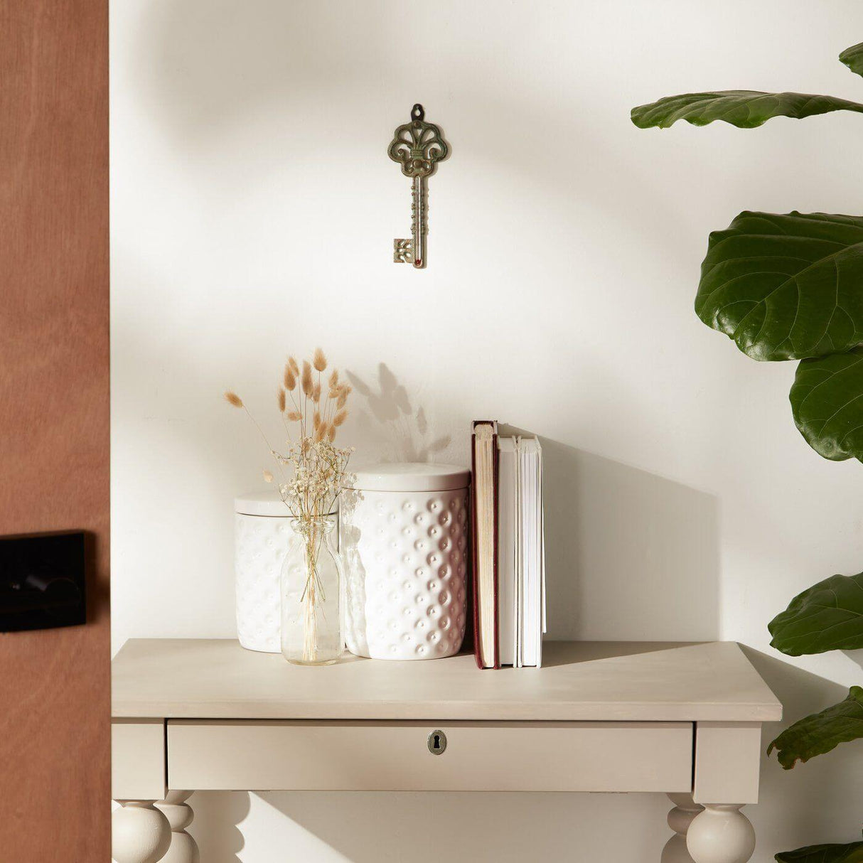 Antique metal key hung above an end table