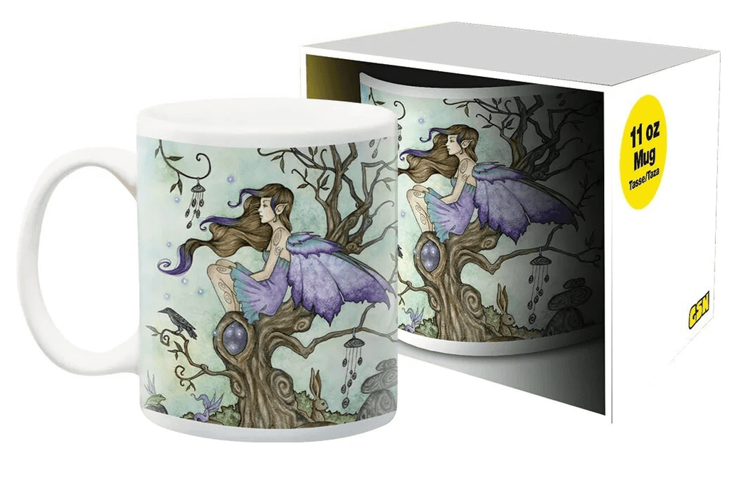 Coffee Mug featuring Amy Brown art of a fairy sitting in a tree with wind chimes and a bird on a pale green background