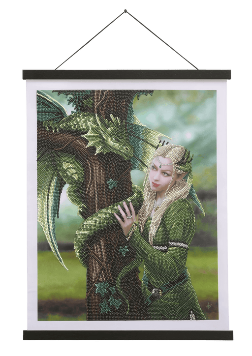 Finished crystal art scroll showing woman in green and dragon wrapped around tree, art by Anne Stokes